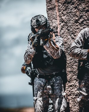 An_Indian_Marine_Commando_looks_down_his_weapon_during_special_operations_urban_combat_trainin...jpg