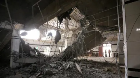 EPA The view from inside a building damaged in a missile strike 
